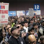 Boeing shores up finances even as striking workers rally