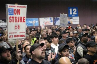 Boeing shores up finances even as striking workers rally