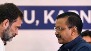 Congress leader Rahul Gandhi shakes hands with Delhi Chief Minister Arvind Kejriwal during the Opposition parties meet