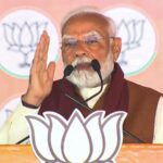 Prime Minister Narendra Modi speaks during a public meeting for Delhi Assembly elections, at Dwarka, in New Delhi.