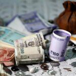 Rupee falls 11 paise to close at 86.33 against US dollar