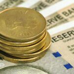 Rupee hits 86 against US dollar, settles 14 paise lower