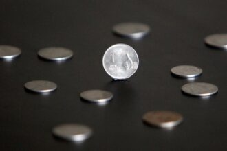 Rupee falls 6 paise to 87.18 against US dollar in early trade